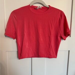 Lululemon Wundermost Ultra-Soft Nulu Crewneck Cropped T-Shirt in coral pink - L
